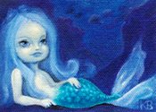 A Lounging Merling, a blue mermaid in the ocean.